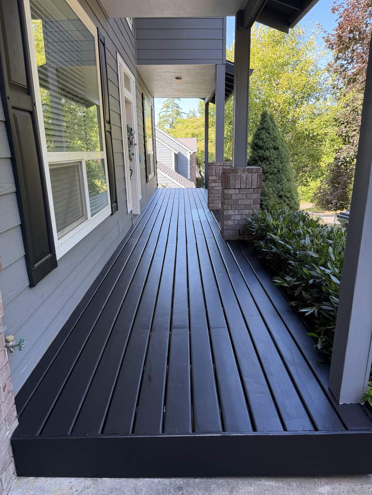 Finished front porch walkway painted black by Gravelle Construction