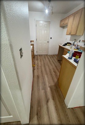 Kitchen with new luxury vinyl plank flooring installed by Gravelle Construction