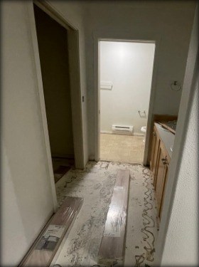 Bathroom and hallway before luxury vinyl plank installation
