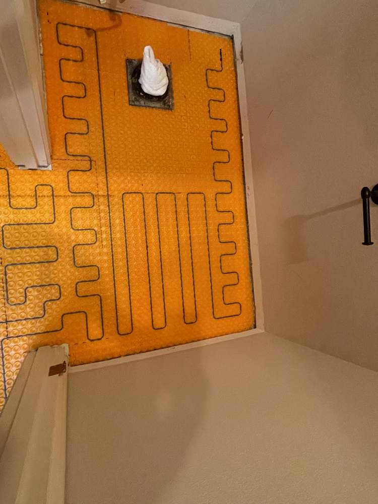 Electric heat cable installed on Ditra-Heat mat before tile