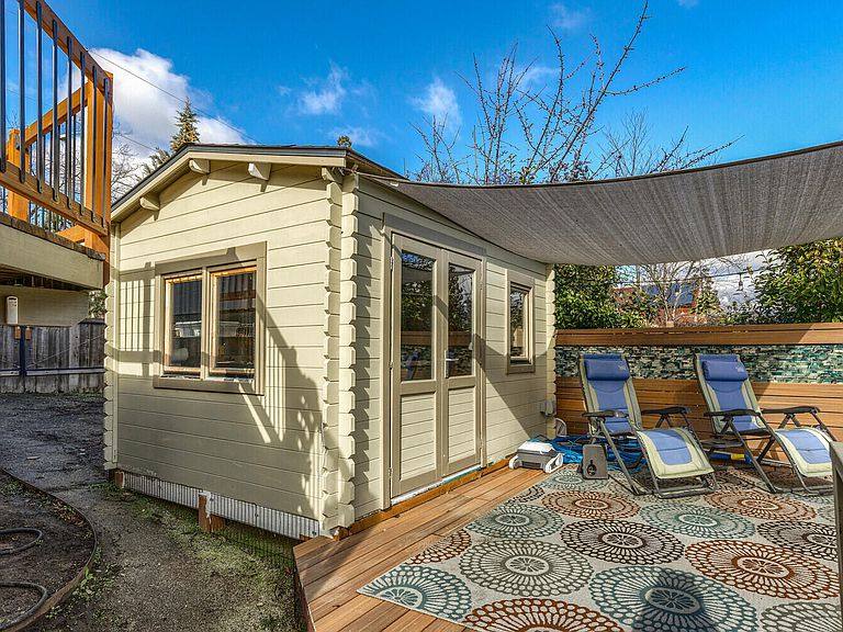 Finished pool house with double doors built by Gravelle Construction