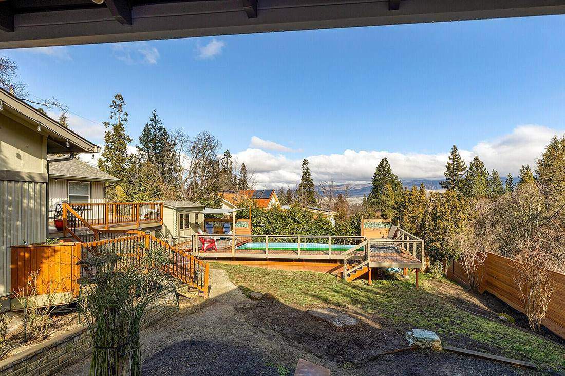 Wide view of the finished pool, deck and pool house