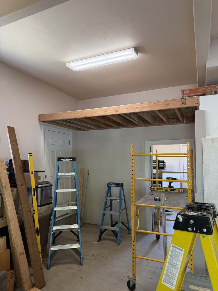 Garage storage loft with new joist framing installed