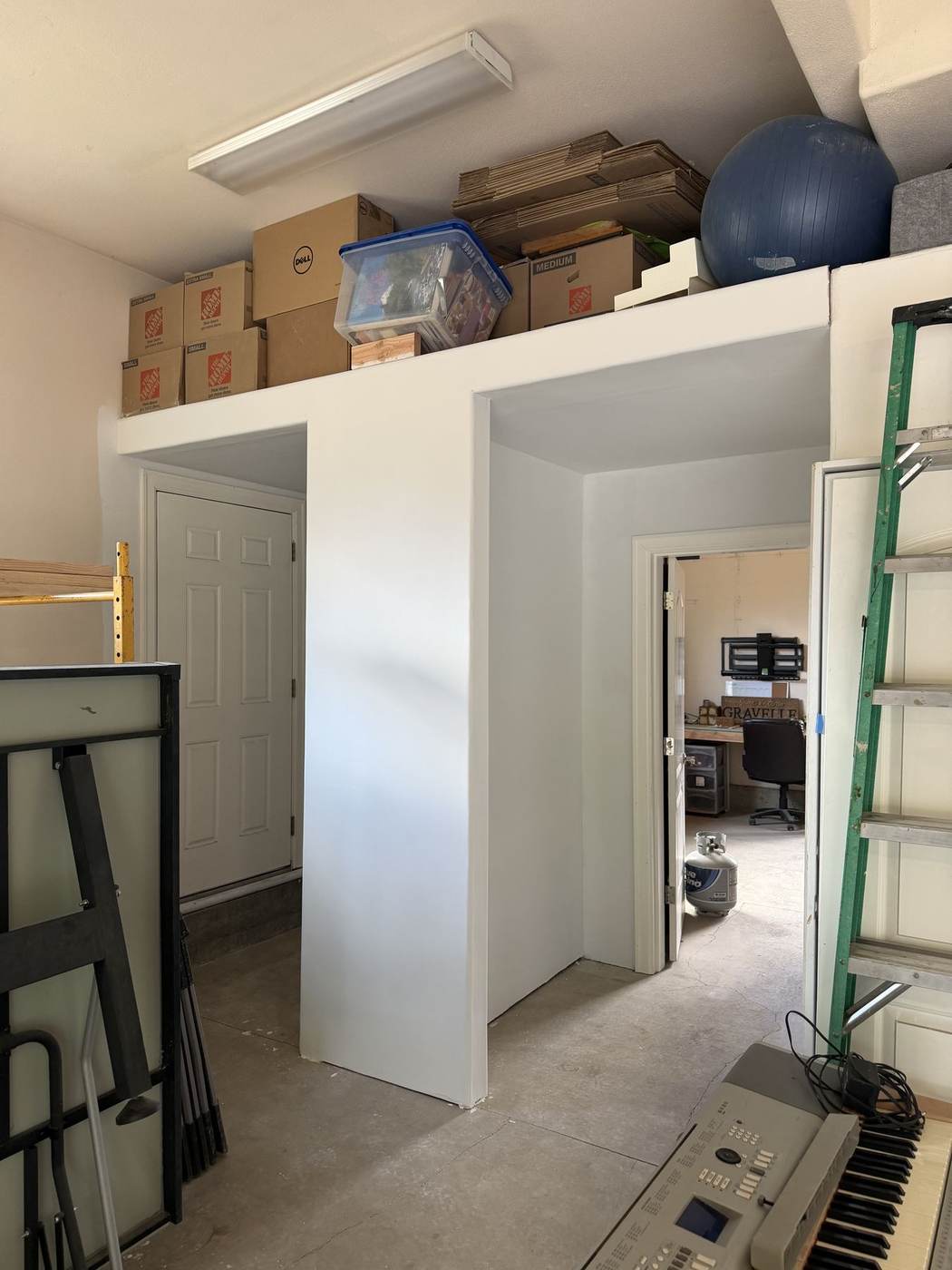 Custom built-in garage storage loft by Gravelle Construction
