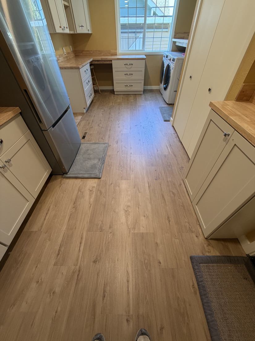 Renovated hobby room with new luxury vinyl plank flooring and cabinetry