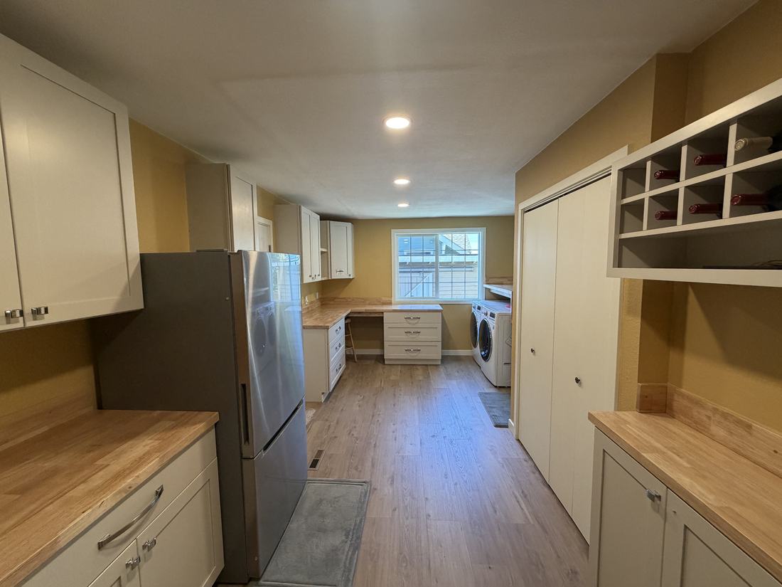 Renovated hobby room built-in corner desk with butcher block counters