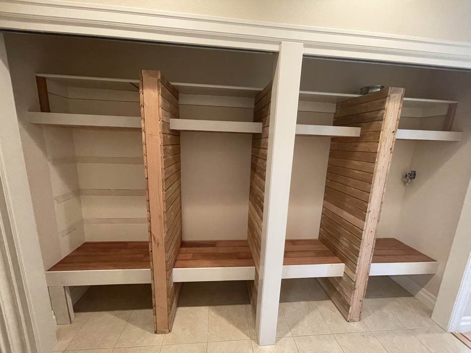 Finished entryway cubbies in use with backpacks, shoes and coats