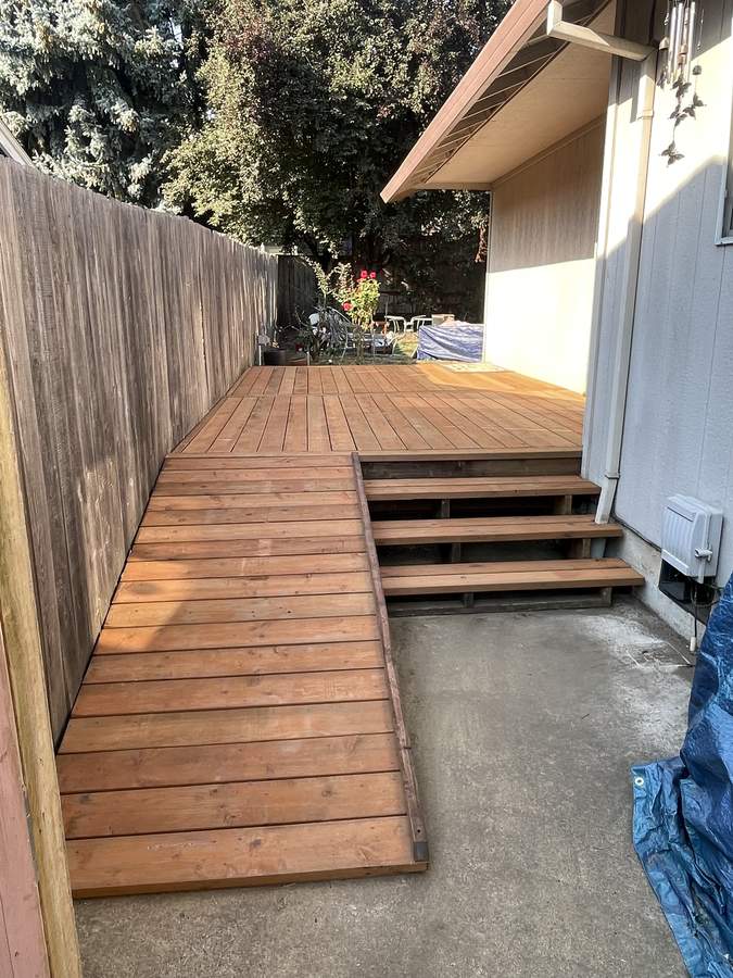 Side deck with built-in wheelchair ramp and steps built by Gravelle Construction