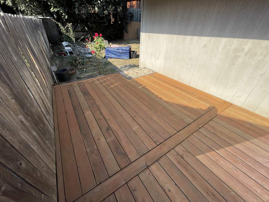 Finished backyard deck with diagonal board pattern by Gravelle Construction